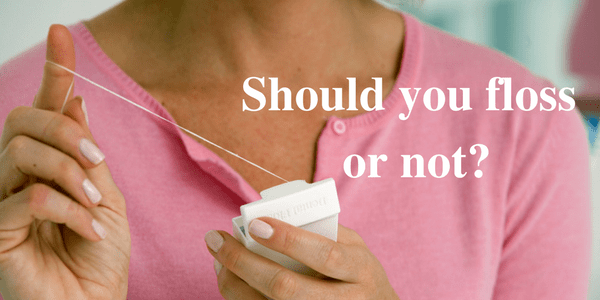 Infographic with text that reads, "should you floss or not" with a picture of a woman holding floss in her hands.