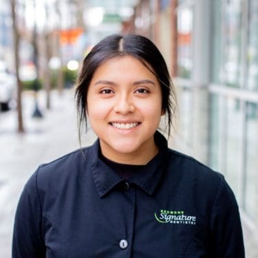 Dental Assitant Nancy smiles outside Redmond Signature Dentistry