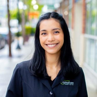 Dental Assistant Alanis smiles outside Redmond Signature Dentistry